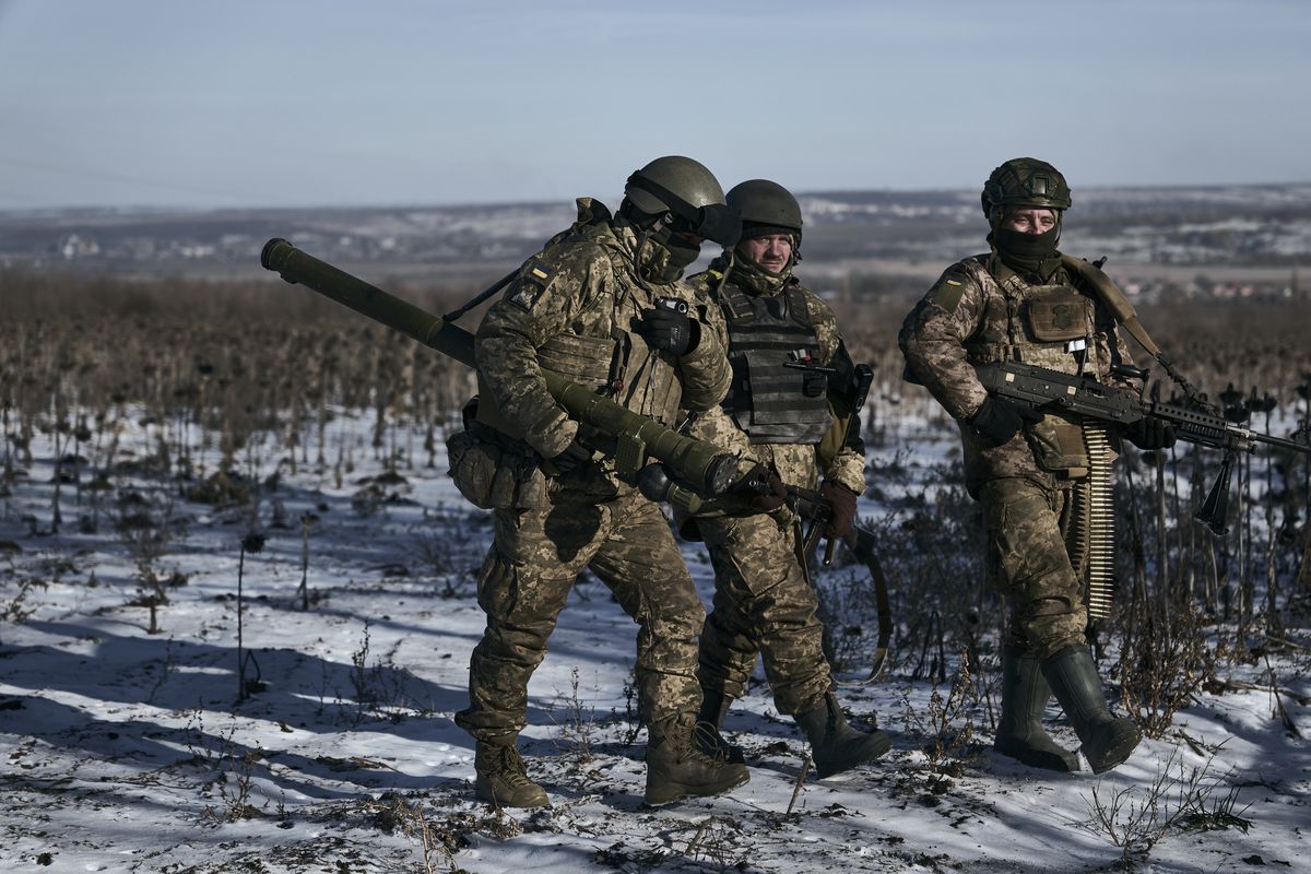 FILE - Ukrainian soldiers on their positions in the frontline near Soledar, Donetsk region, Ukraine, on Jan. 11, 2023. Russia's Defense Ministry said Friday Jan. 13, 2023 that its forces have captured the salt-mining town of Soledar. (AP Photo/Libkos, File)